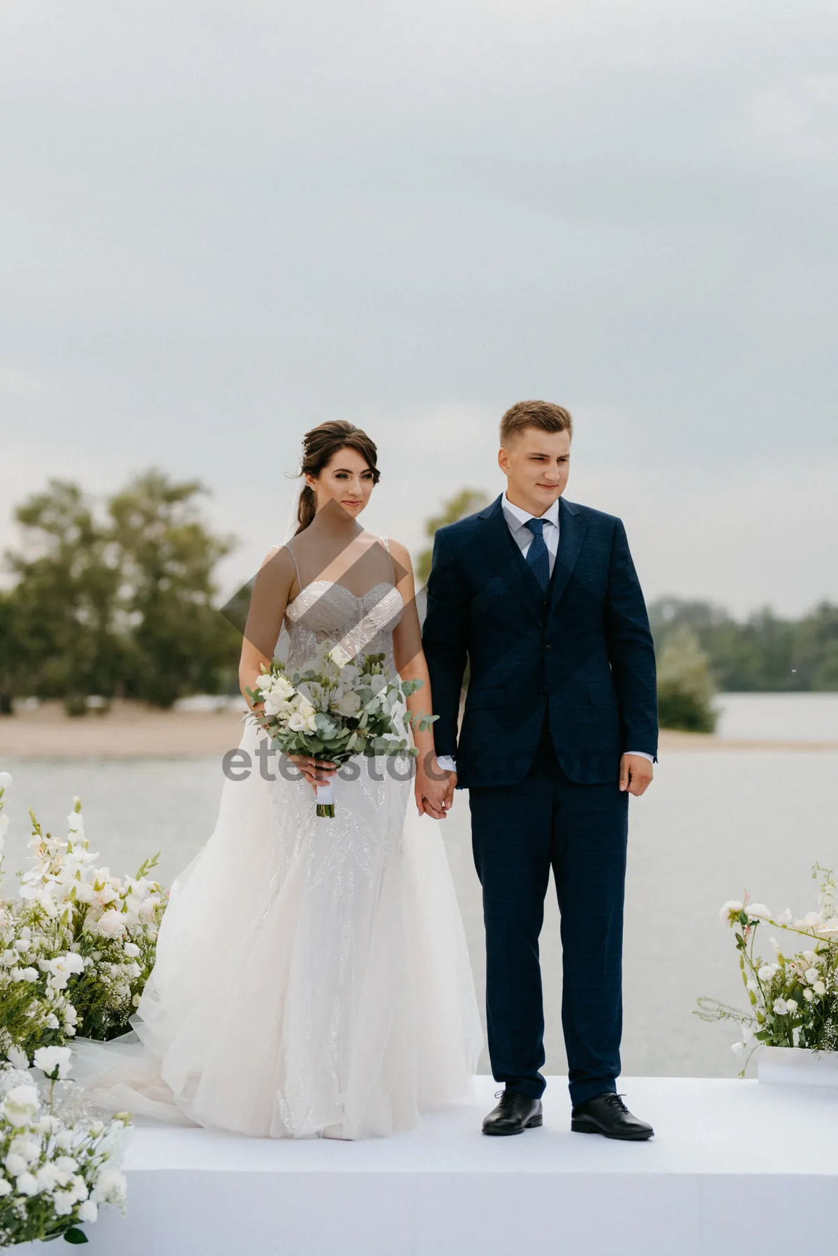 Picture of Happy couple outdoors on wedding day celebrating love