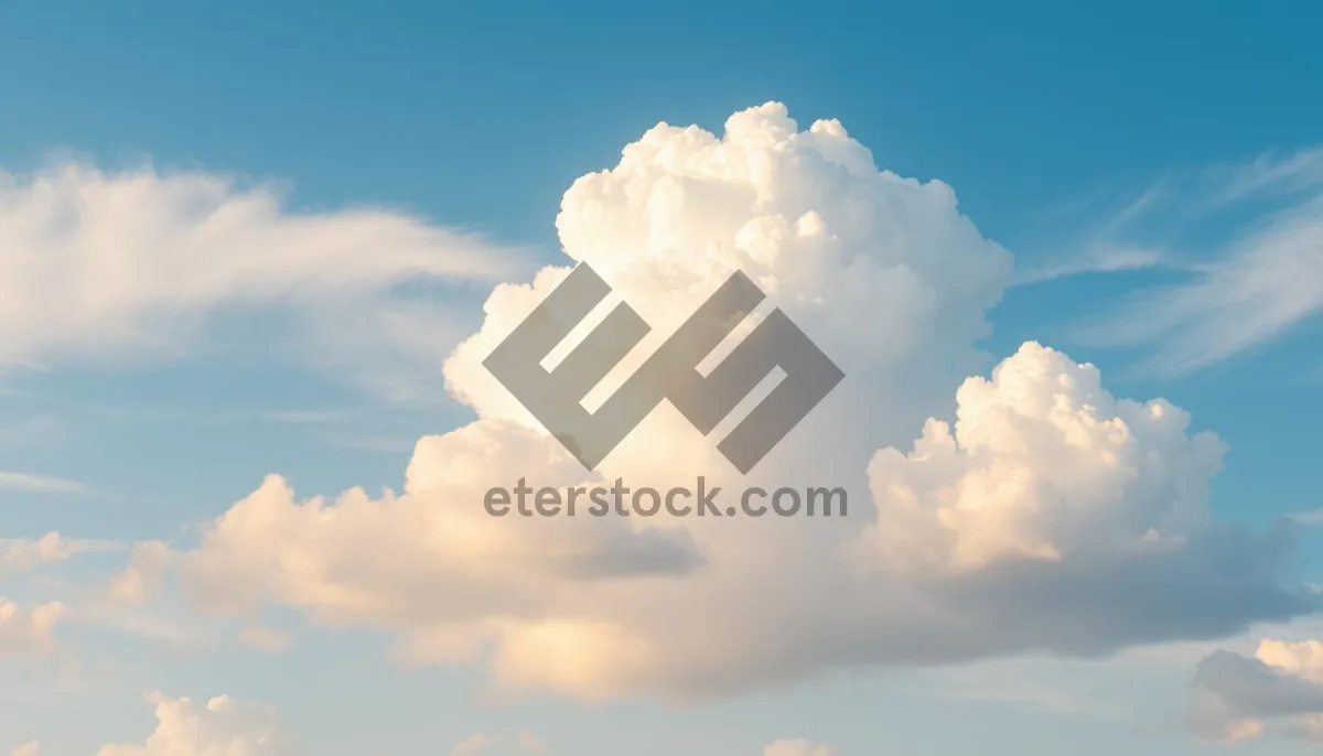 Picture of Sunshine-filled Sky Over Summer Landscape with Fluffy Clouds