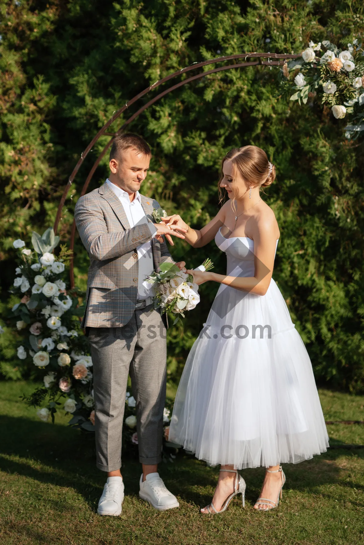 Picture of Happy wedding couple outdoors, smiling and celebrating love.