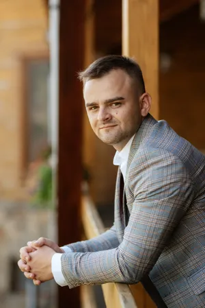 Confident young man smiling in office