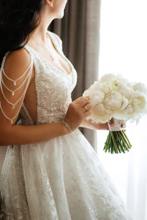 Happy bride in elegant wedding dress