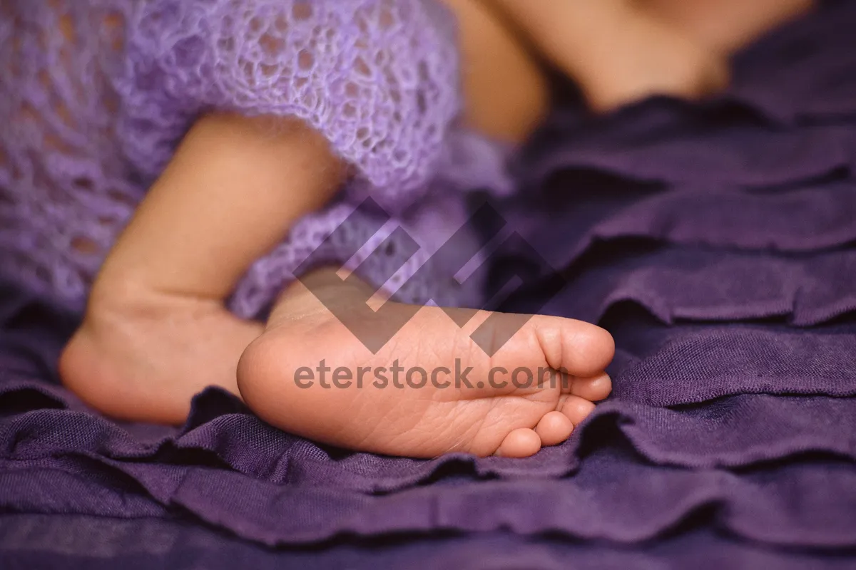 Picture of Baby hand receiving spa treatment from beautician