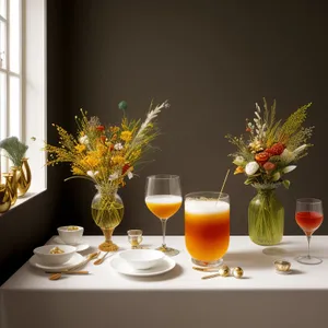 Festive wine and flower arrangement on dining table