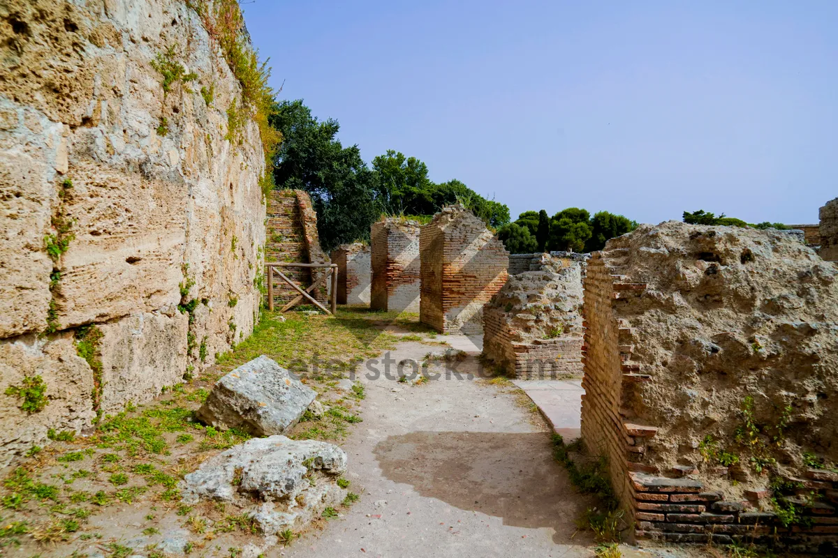 Picture of Ancient cemetery ruins with stone walls and graves.