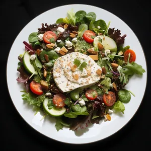 Gourmet Vegetable Plate with Grilled Meat and Cheese