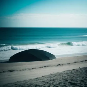 Serene Beach Bliss: Turquoise Waves on Sandy Shore