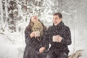 Happy person in stylish fur coat smiling outdoors