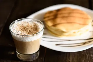 Brown Cappuccino in Glass Cup with Cream Foam