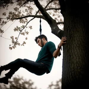 Active adult enjoying outdoor swing play