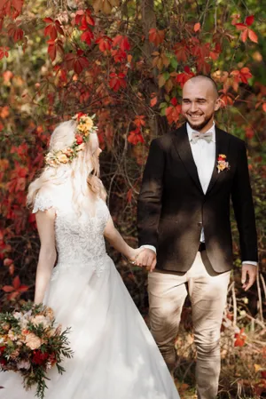 Happy groom and bride celebrating their wedding day outdoors