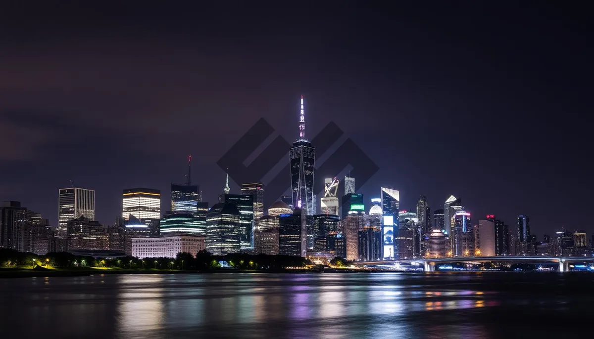 Picture of Modern City Skyline by the Water at Dusk.