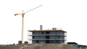 Urban construction crane lifting steel equipment in city skyline.