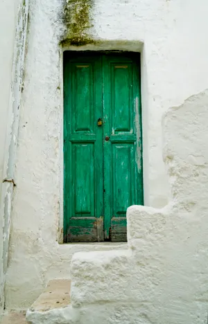 Old stone window detail on ancient house entrance