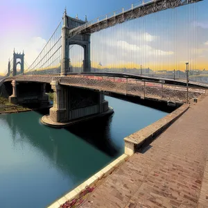 Iconic Nighttime Suspension Bridge Over Urban River