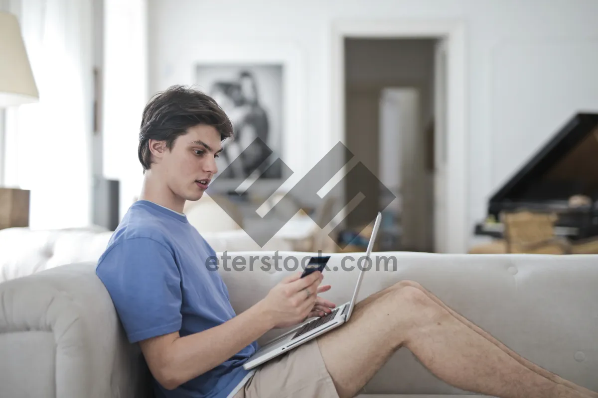 Picture of Smiling businesswoman working on computer at home office