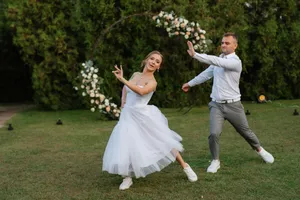 Happy couple newlyweds smiling in summer park celebration.