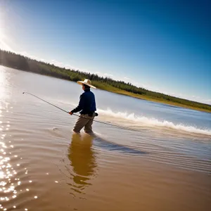 Sunset Fishing: Man Paddling Along the Ocean