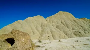 Scenic desert canyon overlooking panoramic mountain landscape.