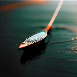 Rotating paddle blade on water surface.