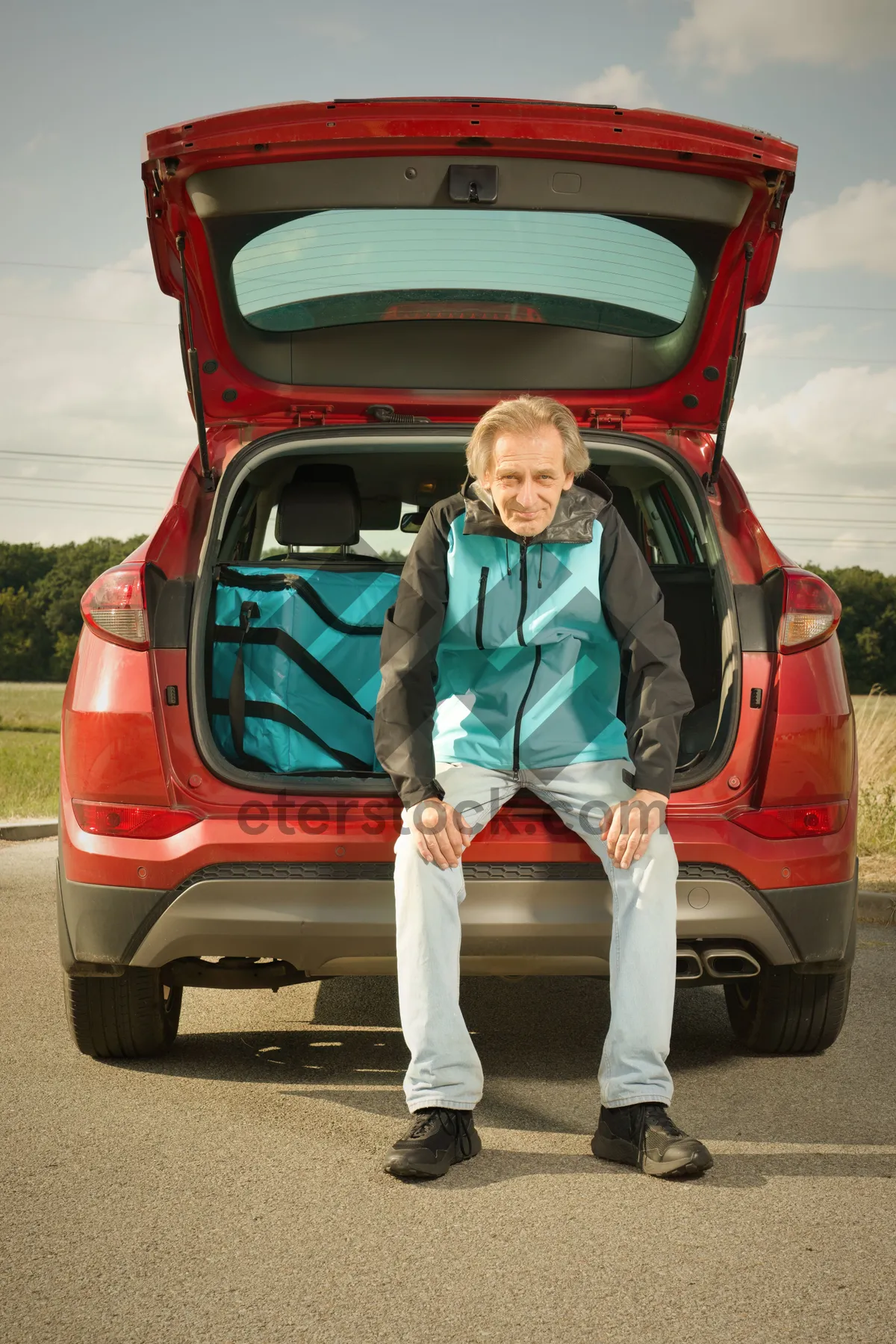 Picture of Driver in Electric Minivan Traveling on the Road