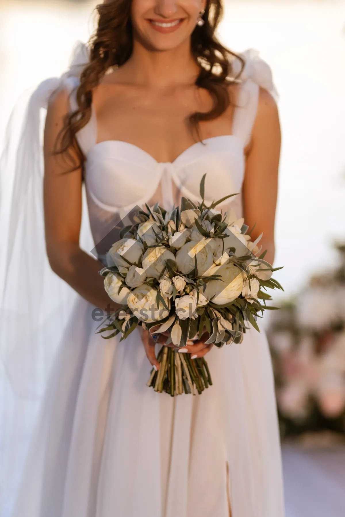 Picture of Happy Bride in Wedding Dress with Flower Bouquet