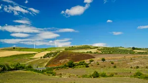 Mountains and Clouds Over Rural Landscape