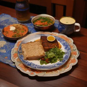 Delicious Gourmet Meal with Grilled Vegetables and Sauce