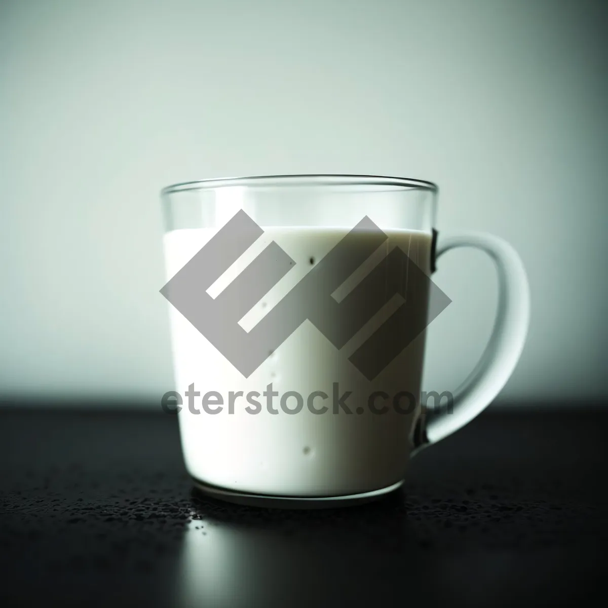 Picture of Hot Coffee in Black Mug with Saucer on Table
