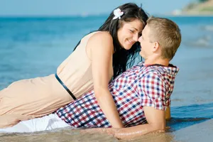 Happy family on summer vacation at the beach