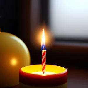 Celebration of Light: Burning Candle Illuminating Darkness