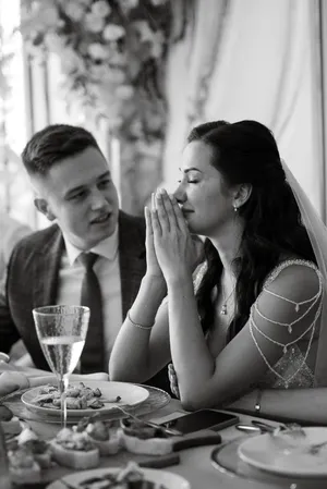 Happy couple enjoying wine at a restaurant table