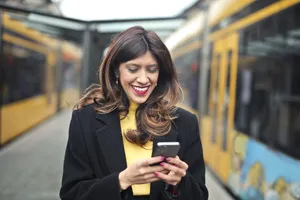 Confident businesswoman with smartphone in office setting