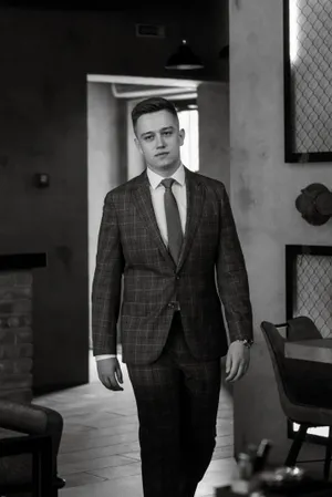 Confident businessman standing in office