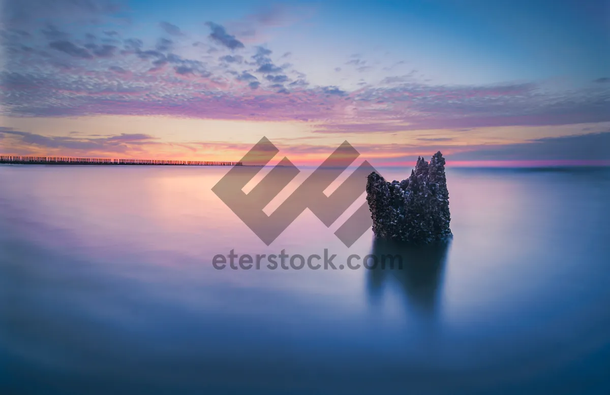 Picture of Picturesque sunset over tranquil beach landscape.