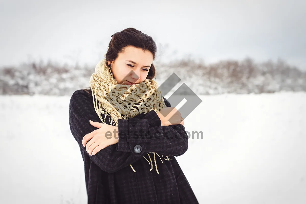 Picture of Attractive brunette lady wearing fashion jacket and scarf.