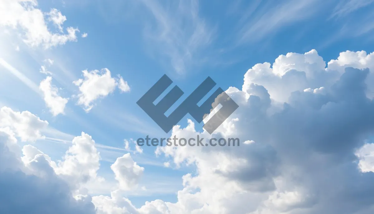 Picture of Vibrant summer sky with fluffy clouds and sunlight