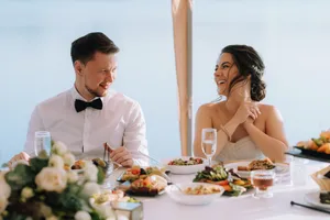 Happy man enjoying meal at restaurant table