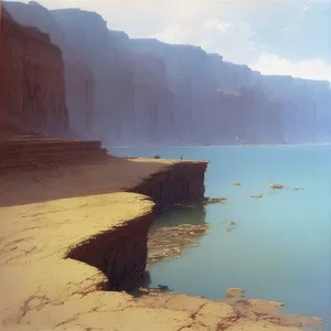 Serene Beachscape with Majestic Cliff and Crashing Waves.