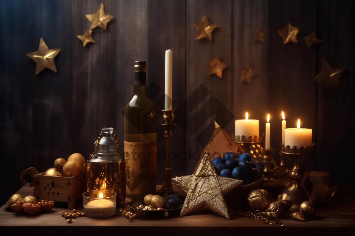 Picture of Gold menorah candlestick on decorative altar in dim light.