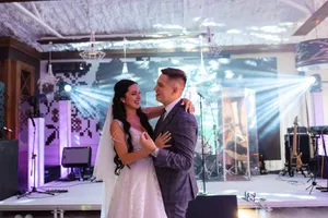 Happy groom and bride in wedding attire