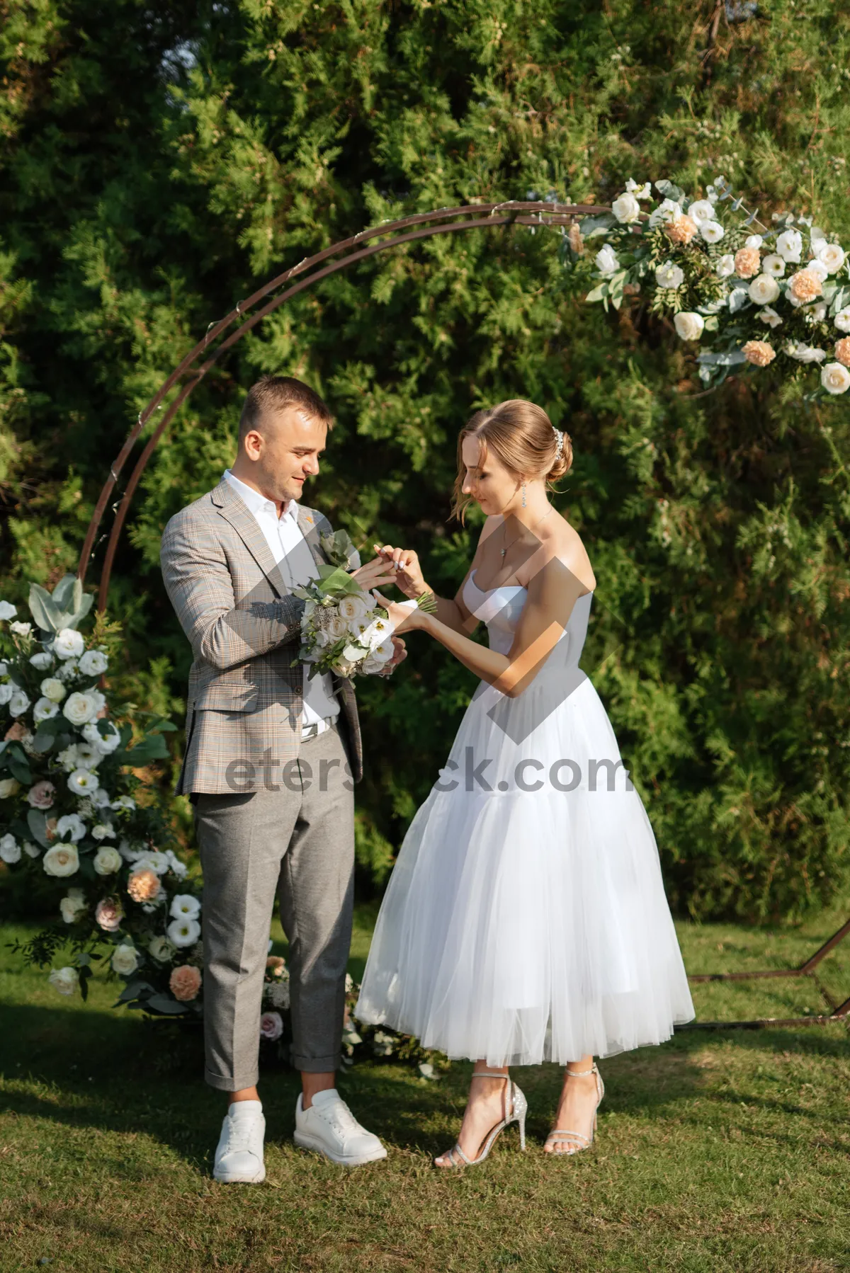 Picture of Happy wedding couple smiling outdoors on their special day.