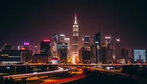 Modern business office building at night with city lights