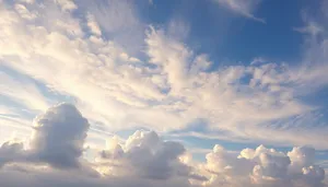 Bright summer sky with fluffy clouds.