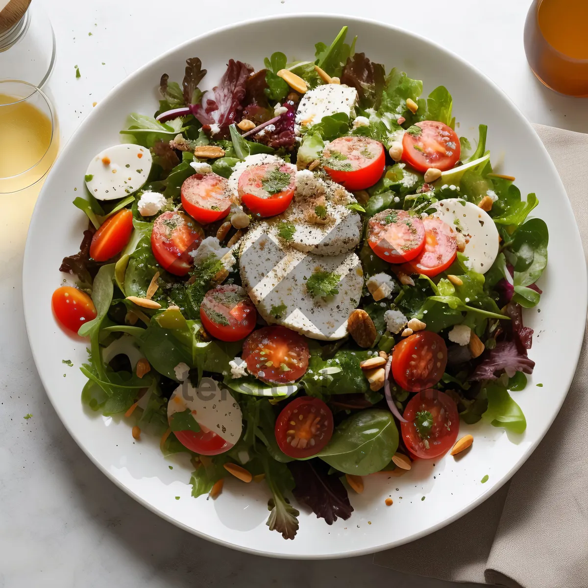 Picture of Gourmet vegetable salad on white plate- image description.