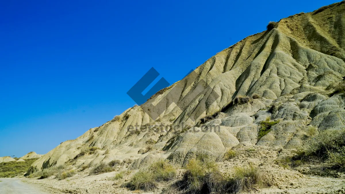 Picture of Mountain Range and Cliff Overlooking Valley in Summer