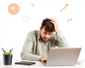 Smiling businesswoman working on laptop in office