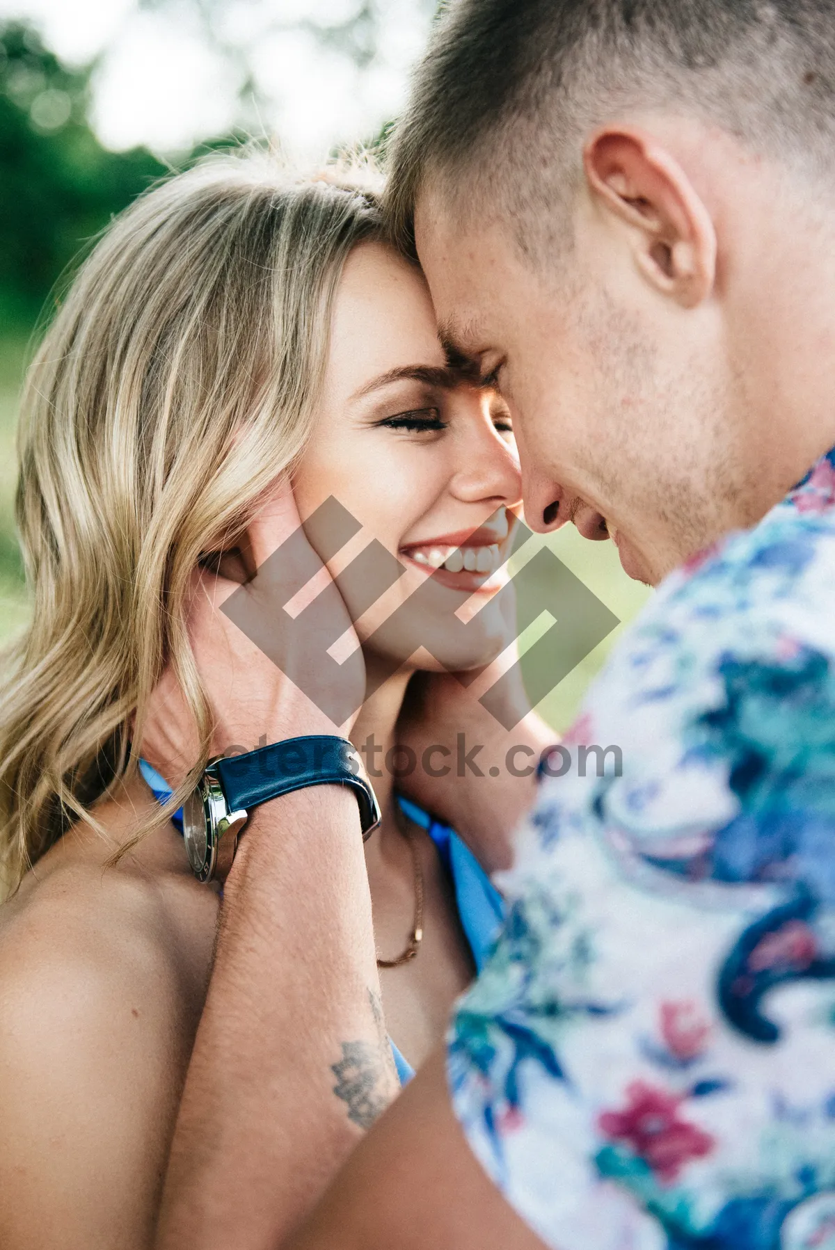 Picture of Happy couple smiling in the park together