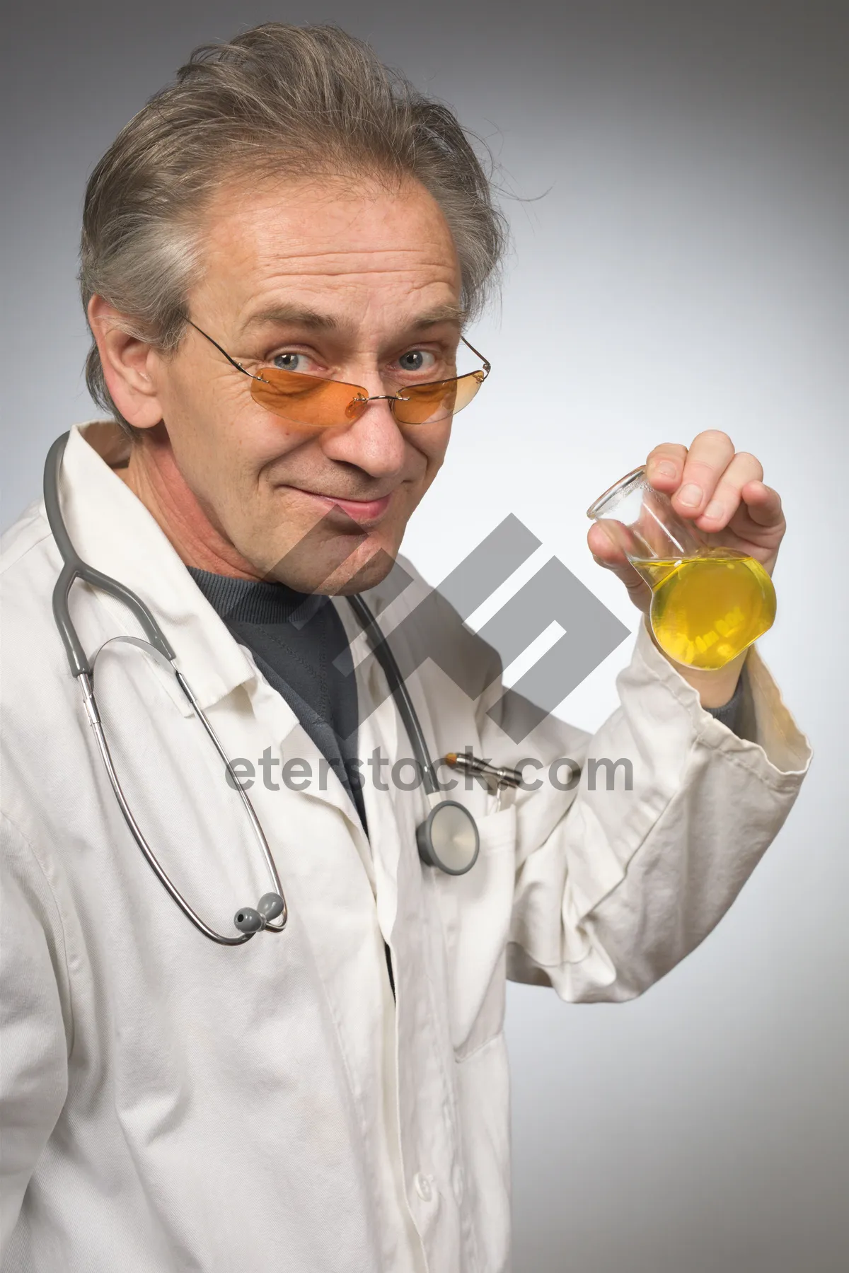 Picture of Smiling senior doctor in lab coat with stethoscope