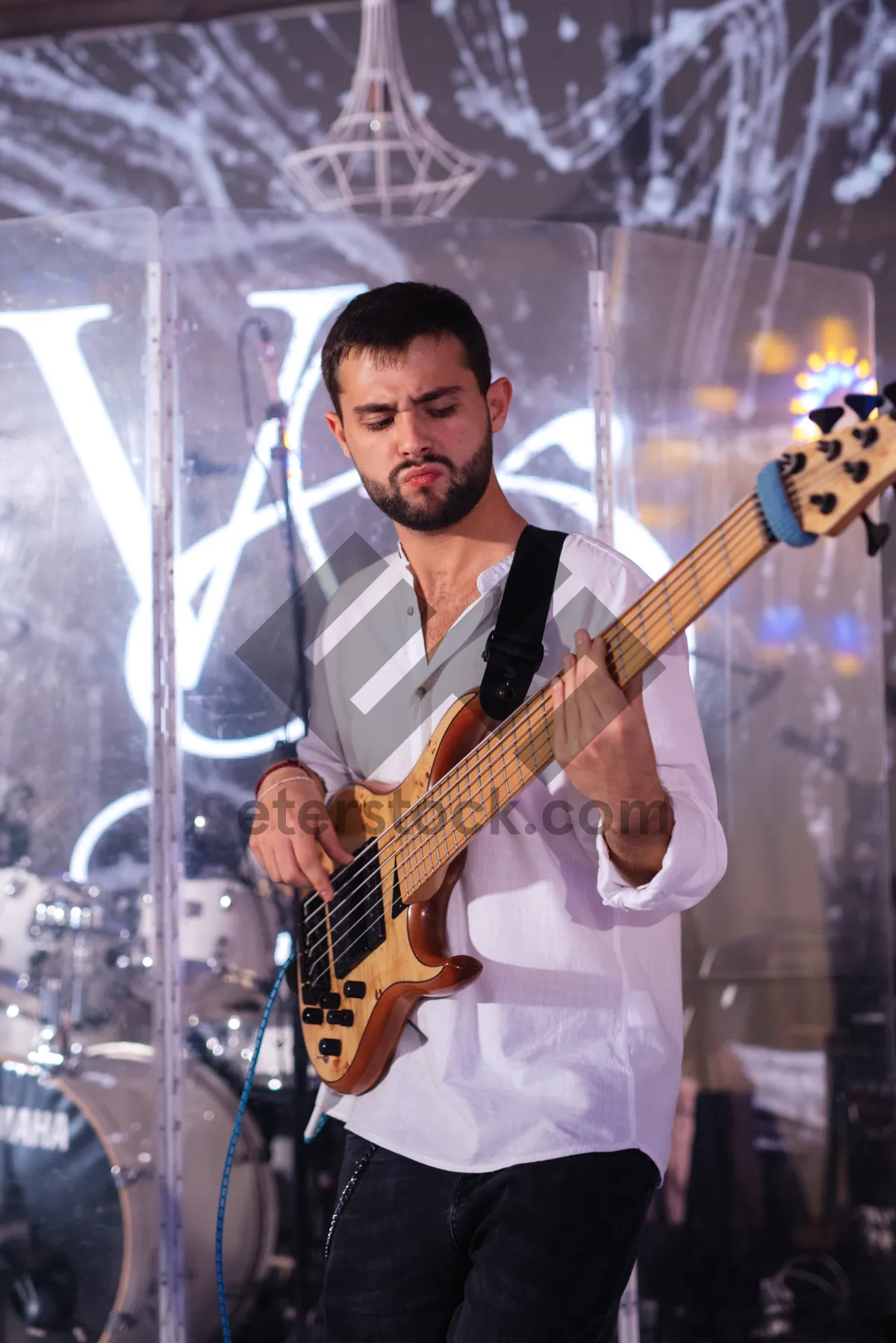 Picture of Cool Rock Bass Player on Stage Performing.