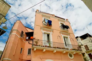 Old city building with balcony in town.